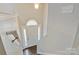 Bright foyer featuring a white front door with sidelights and transom window, leading to hardwood floors at 2835 24Th Street Ne Dr, Hickory, NC 28601