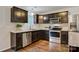 Modern kitchen with dark cabinetry, stainless steel appliances, and ample counter space at 2835 24Th Street Ne Dr, Hickory, NC 28601