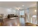 Bright living room featuring hardwood floors, a ceiling fan, and a large window at 2835 24Th Street Ne Dr, Hickory, NC 28601