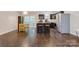 Spacious open-concept living room with bar stool seating, an adjacent dining area and stainless steel appliances at 2835 24Th Street Ne Dr, Hickory, NC 28601