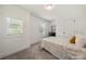 Bright bedroom with natural light from two windows and soft carpet flooring at 3205 Morning Dr, Charlotte, NC 28208