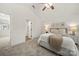 Bright bedroom with a vaulted ceiling and neutral color palette with soft carpet at 3205 Morning Dr, Charlotte, NC 28208