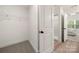 Walk-in closet with view to bedroom and an adjacent bathroom at 3205 Morning Dr, Charlotte, NC 28208