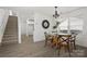 Dining room features a glass table, wood chairs, and lots of natural light at 3205 Morning Dr, Charlotte, NC 28208