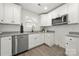 Bright kitchen featuring stainless steel appliances, modern cabinetry, and granite countertops at 3205 Morning Dr, Charlotte, NC 28208