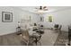 A bright living room offers a cozy seating area and a view of the outdoors at 3205 Morning Dr, Charlotte, NC 28208