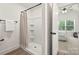 Bathroom with shower and shower curtain and an open view to the bedroom at 3205 Morning Dr, Charlotte, NC 28208