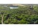 Scenic aerial view of the property surrounded by lush greenery, featuring an abundance of mature trees at 328 Earl Griffin Rd, Monroe, NC 28112