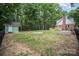 Large backyard featuring a firepit and a storage shed at 328 Earl Griffin Rd, Monroe, NC 28112
