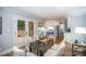Elegant dining room with a view to the kitchen and a glass table, perfect for entertaining guests at 328 Earl Griffin Rd, Monroe, NC 28112