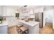 Modern white kitchen featuring stainless steel appliances and a large island at 328 Earl Griffin Rd, Monroe, NC 28112