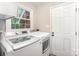 Laundry room featuring a washer, dryer and natural light at 328 Earl Griffin Rd, Monroe, NC 28112