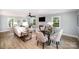 Inviting living room featuring a fireplace, dining area and views of the outdoors at 328 Earl Griffin Rd, Monroe, NC 28112