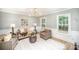 Living room with an accent rug, neutral decor and natural light from large windows at 328 Earl Griffin Rd, Monroe, NC 28112