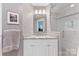 Updated bathroom featuring a glass door shower and a vanity with granite countertop at 3329 Winnipeg Cir, Charlotte, NC 28210
