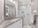 Modern bathroom showcasing a glass door shower and granite vanity top at 3329 Winnipeg Cir, Charlotte, NC 28210