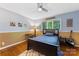Comfortable bedroom featuring a study desk, and hardwood floors at 3329 Winnipeg Cir, Charlotte, NC 28210