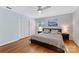 Comfortable bedroom featuring hardwood floors, soft lighting, and a ceiling fan for added appeal at 3329 Winnipeg Cir, Charlotte, NC 28210