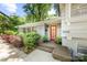 Close up of front door, plants, and brick facade at 3329 Winnipeg Cir, Charlotte, NC 28210
