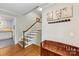 Hallway featuring staircase and view into the kitchen at 3329 Winnipeg Cir, Charlotte, NC 28210