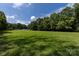 Expansive green lawn, perfect for outdoor activities and enjoying the natural surroundings at 3329 Winnipeg Cir, Charlotte, NC 28210