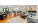 Spacious living room flows into kitchen with breakfast bar and features hardwood floors and a neutral color palette at 3329 Winnipeg Cir, Charlotte, NC 28210