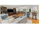 Open-concept living room with bar seating and view into the dining area at 3329 Winnipeg Cir, Charlotte, NC 28210