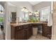 Beautiful primary bathroom featuring double sink vanity, large mirror, and natural light at 3398 Millstone Creek Rd, Lancaster, SC 29720