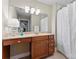 Classic bathroom featuring vanity with countertop, large mirror, and shower with curtain at 3398 Millstone Creek Rd, Lancaster, SC 29720
