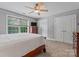 Well-lit bedroom offering a ceiling fan, large windows, and generous closet space at 3398 Millstone Creek Rd, Lancaster, SC 29720