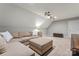 The bonus room has a sectional sofa, plush carpeting, and neutral wall paint at 3398 Millstone Creek Rd, Lancaster, SC 29720