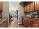 Convenient butler pantry with custom cabinetry, granite countertops, and beverage station, located off the dining area at 3398 Millstone Creek Rd, Lancaster, SC 29720