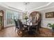 Formal dining room with large table, elegant hutch, chandelier, and ample seating at 3398 Millstone Creek Rd, Lancaster, SC 29720