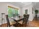 Cozy dining area with wooden table, chairs, and a view to the outdoors at 3398 Millstone Creek Rd, Lancaster, SC 29720