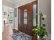 Elegant foyer with stained-glass door, hardwood floors, and view into other rooms at 3398 Millstone Creek Rd, Lancaster, SC 29720