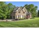 Brick home with manicured landscaping and a winding driveway at 3398 Millstone Creek Rd, Lancaster, SC 29720