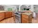 Spacious kitchen features stainless steel appliances, granite countertops, and hardwood floors at 3398 Millstone Creek Rd, Lancaster, SC 29720
