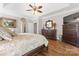 The main bedroom shows a ceiling fan, and a large wood dresser with a mirror at 3398 Millstone Creek Rd, Lancaster, SC 29720