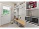 Organized mudroom with built-in shelving, bench, and storage, offering practicality and convenience at 3398 Millstone Creek Rd, Lancaster, SC 29720