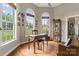 Well-lit office space featuring hardwood floors, arched windows, and a view of the outdoors at 3398 Millstone Creek Rd, Lancaster, SC 29720