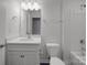 A well-lit bathroom featuring a large mirror, white cabinetry, and a combination tub and shower at 4027 Gozzi Dr, Iron Station, NC 28080
