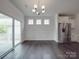 Bright dining area with stylish lighting and sliding doors to the outdoor deck at 4027 Gozzi Dr, Iron Station, NC 28080