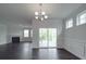 Spacious living room with a fireplace and sliding glass doors to the outdoor patio at 4027 Gozzi Dr, Iron Station, NC 28080