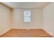 Bedroom featuring neutral paint, wood laminate flooring, base trim and a window at 405 Belva St, Kannapolis, NC 28081