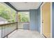Inviting front porch with wood railing detail and blue siding at 405 Belva St, Kannapolis, NC 28081