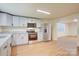 Spacious kitchen featuring granite countertops, stainless steel appliances, and new wood floors at 405 Belva St, Kannapolis, NC 28081