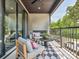 Cozy balcony with stylish seating and a checkered rug offering great outdoor views at 411 Old Town Village Rd, Waxhaw, NC 28173