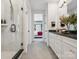 A well-lit bathroom with glass shower and a view into the bedroom through an open door at 411 Old Town Village Rd, Waxhaw, NC 28173