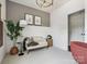 Comfortable bedroom featuring a cozy sofa, lamp and view through an open doorway at 411 Old Town Village Rd, Waxhaw, NC 28173