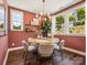 Bright dining room features a modern chandelier, table, and natural light at 411 Old Town Village Rd, Waxhaw, NC 28173